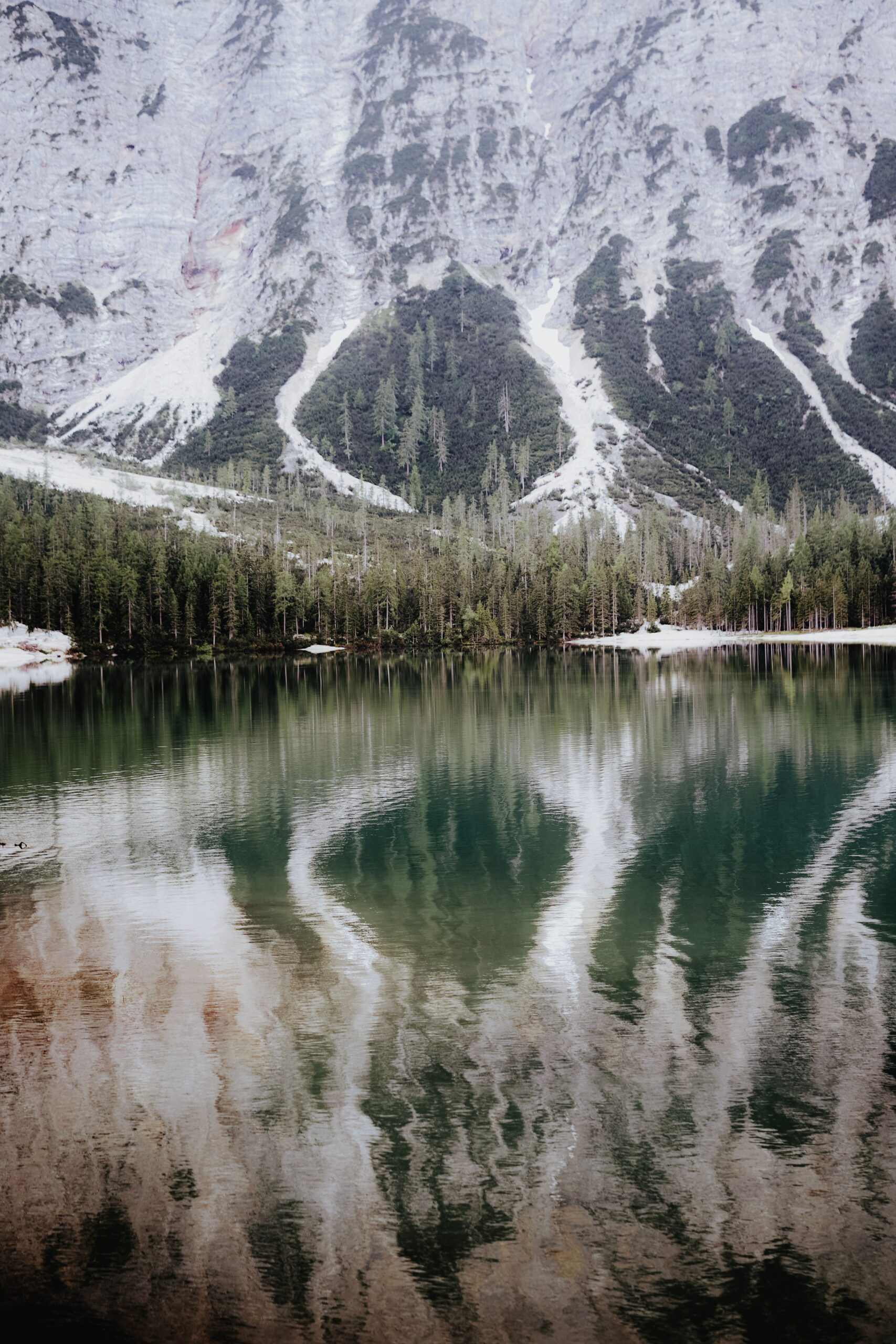 Alpine lake with mountain reflection near Kagbhusandi Tal